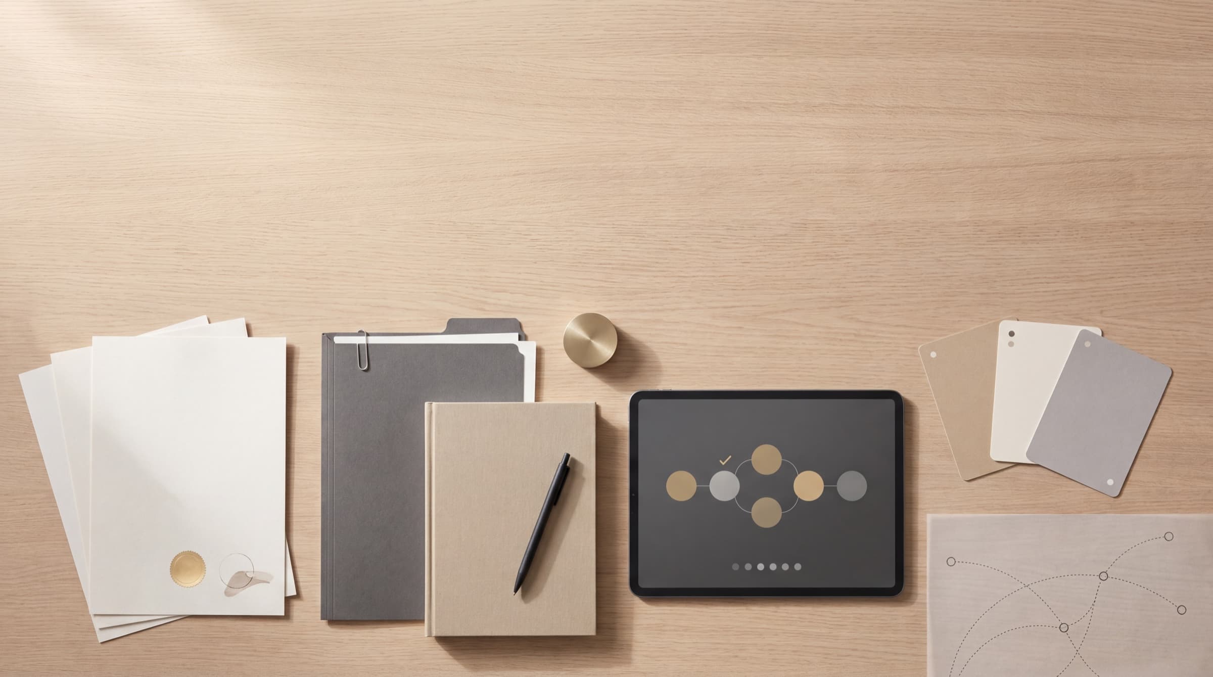 Trademark documents, filing folders and an abstract lifecycle dashboard arranged on a calm consultancy workspace